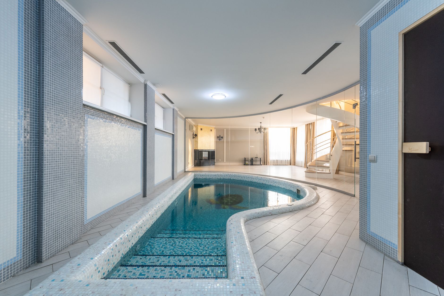 Luxurious exclusive mansions for sale featuring private indoor pools and elegant design.